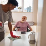 Young man doing the cleaning in the kitchen